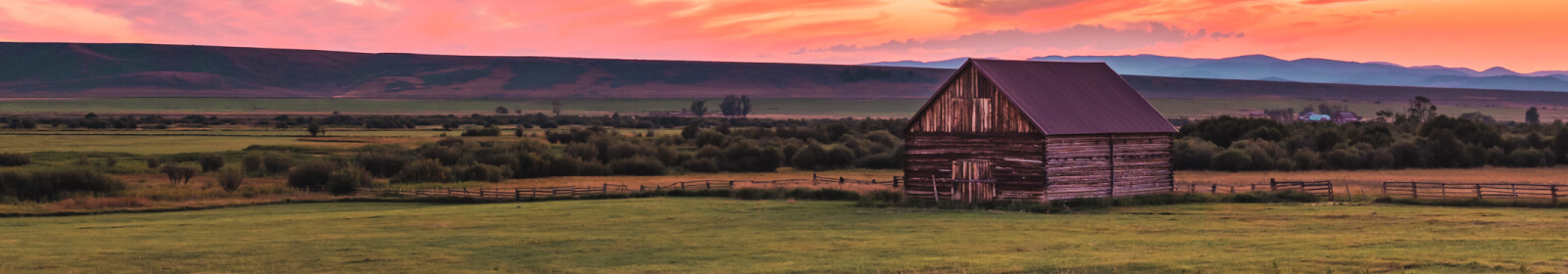 Landscape of a barn in a field